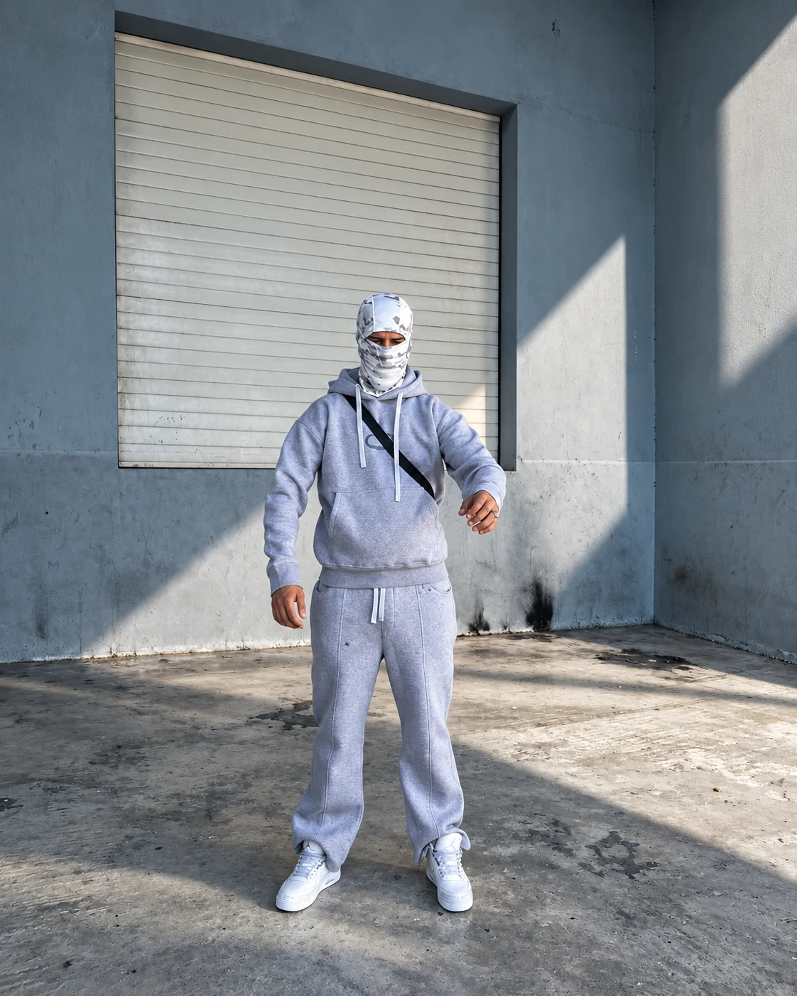NORMEN in a grey outfit